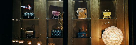 Bags displayed in a retail glass cabinet