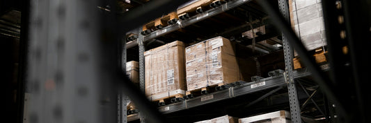 Boxed stock on pallets across a warehouse floor