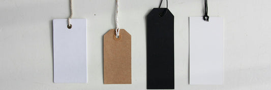 Four blank card swing tags waiting to be printed