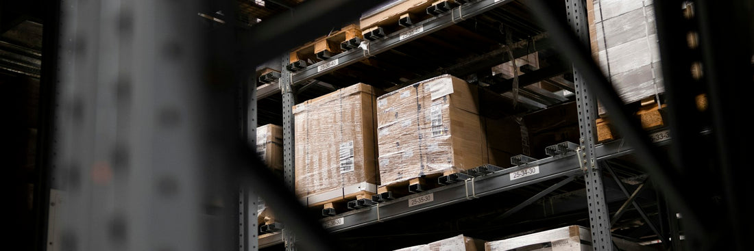 Boxed stock on pallets across a warehouse floor