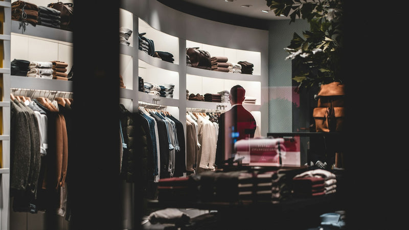 Design-led backpacks merchandised on the shelves of an independent boutique